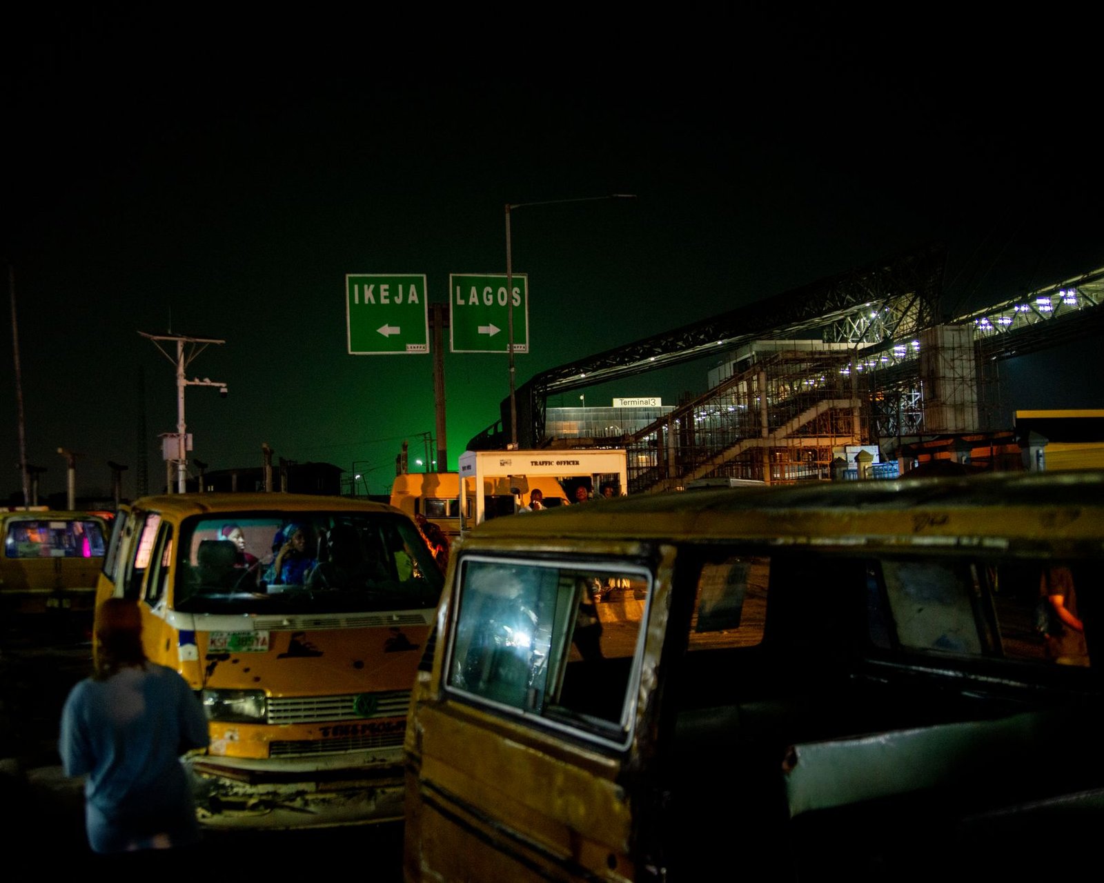 Quiet well-lit street in a Nigerian city after dark