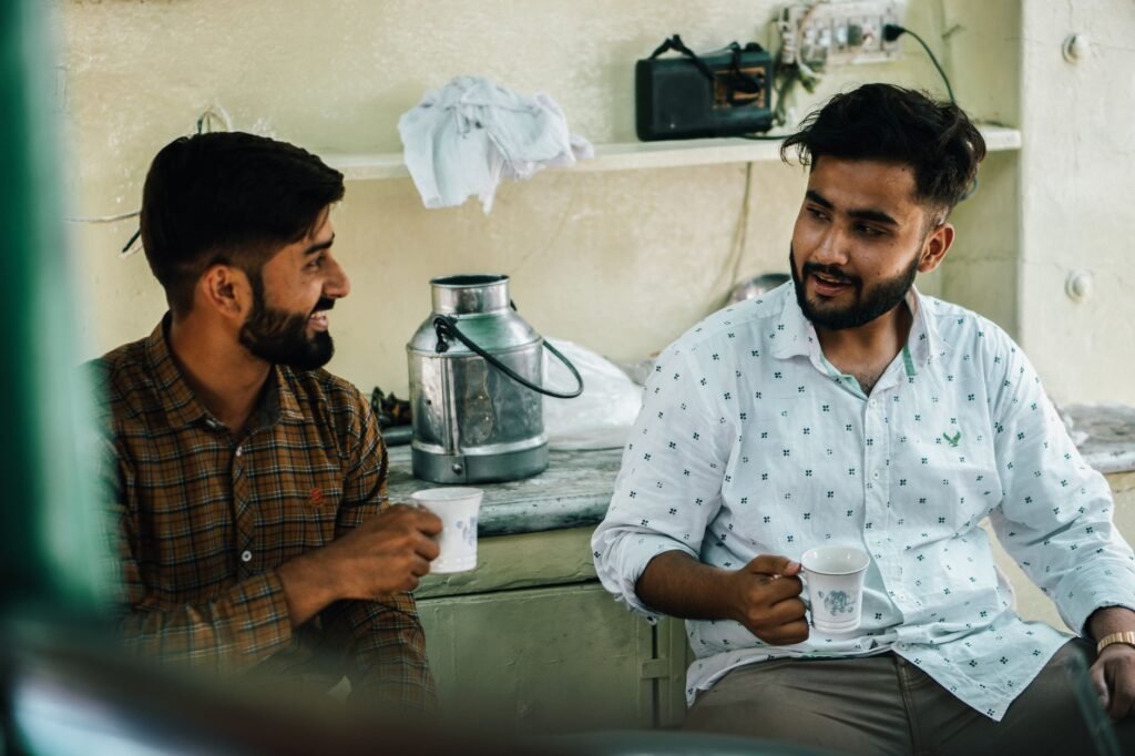 Two adults having a calm conversation over tea at a small table