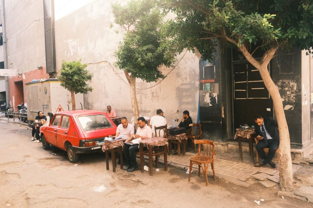 Two adults having a calm daytime conversation at an outdoor cafe