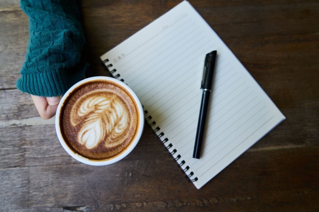 Notebook and phone on a table used for planning a discreet trip