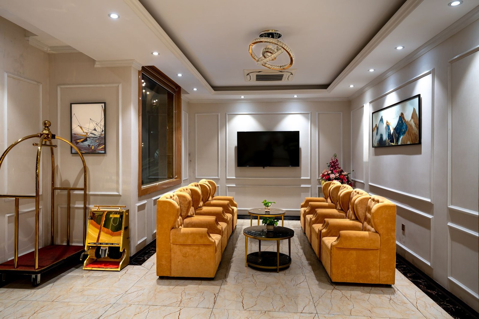 Quiet hotel lobby seating area with two armchairs and warm evening light