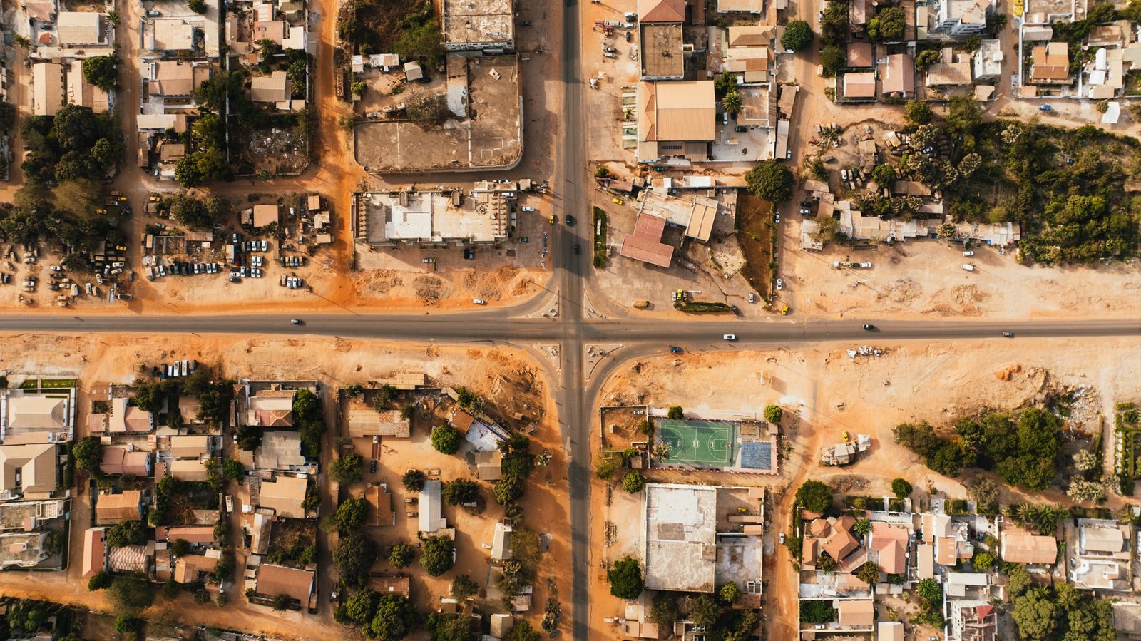 Quiet main road junction in a small town in Benue State, Nigeria, at golden hour