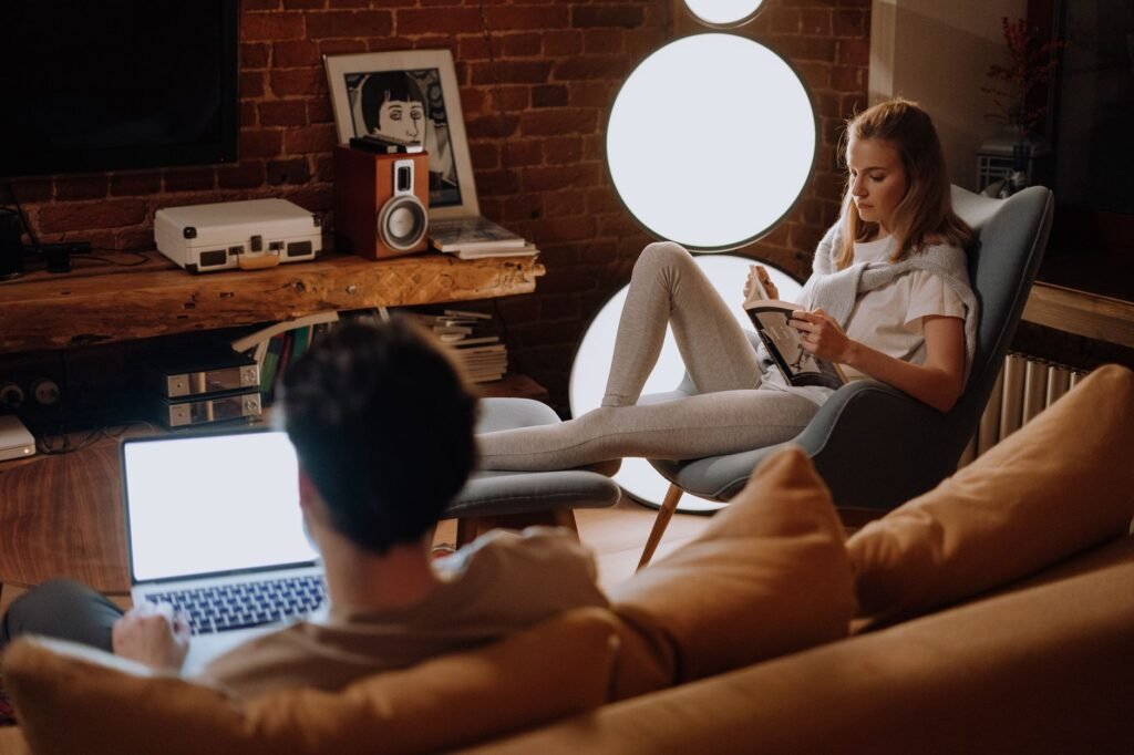 Person reading profiles on a laptop at home in the evening