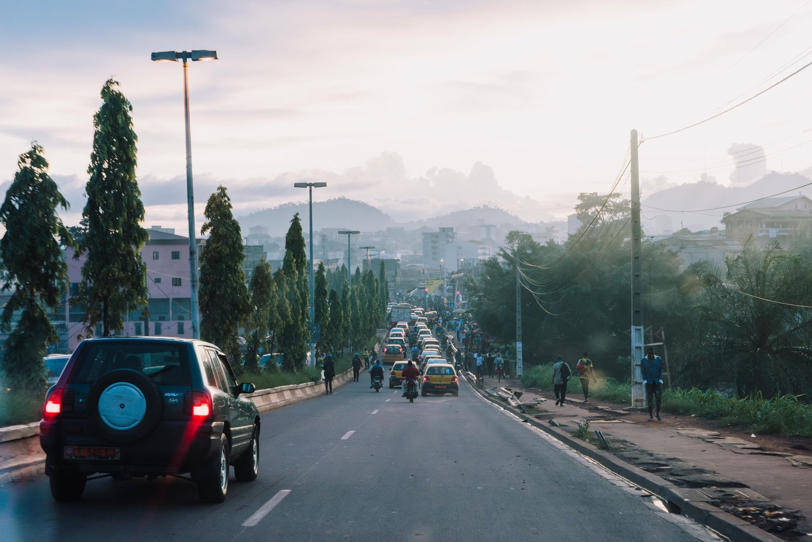 Quiet residential street in a Nigerian town in Osun State during the late afternoon