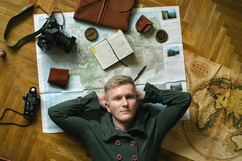 Traveller planning a trip with a smartphone and notebook on a hotel desk