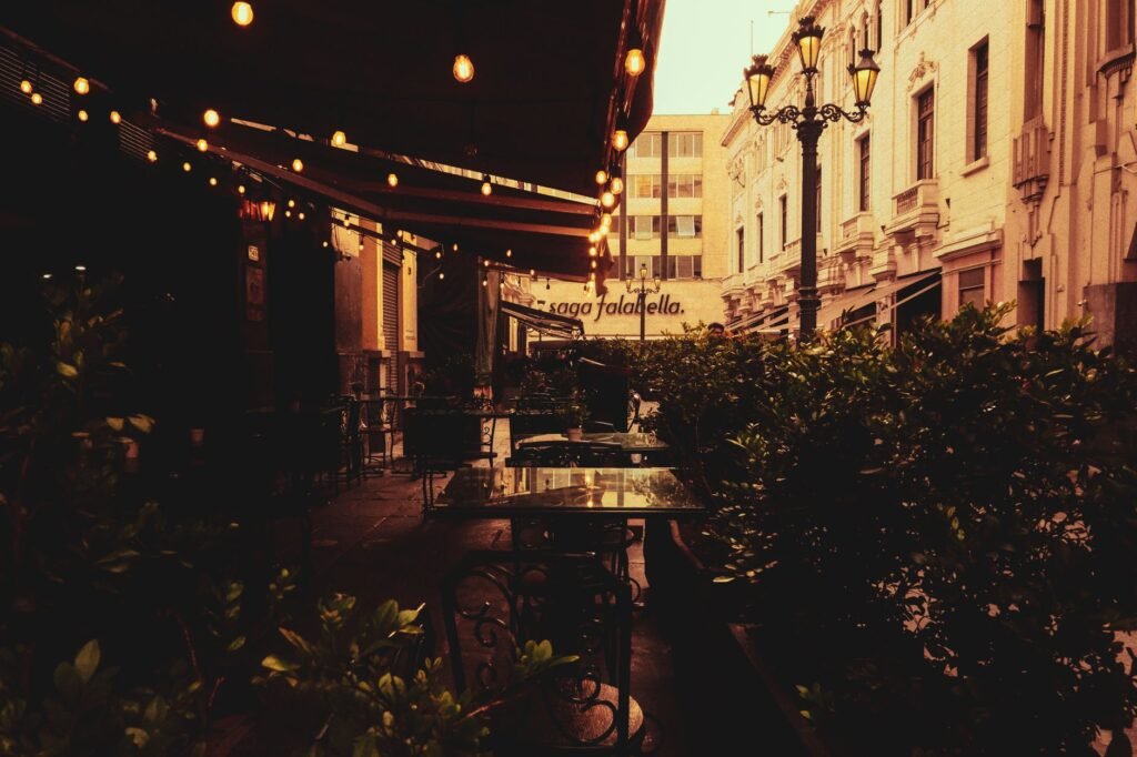 Well-lit outdoor seating area in the evening, suggested as a safe first meeting place