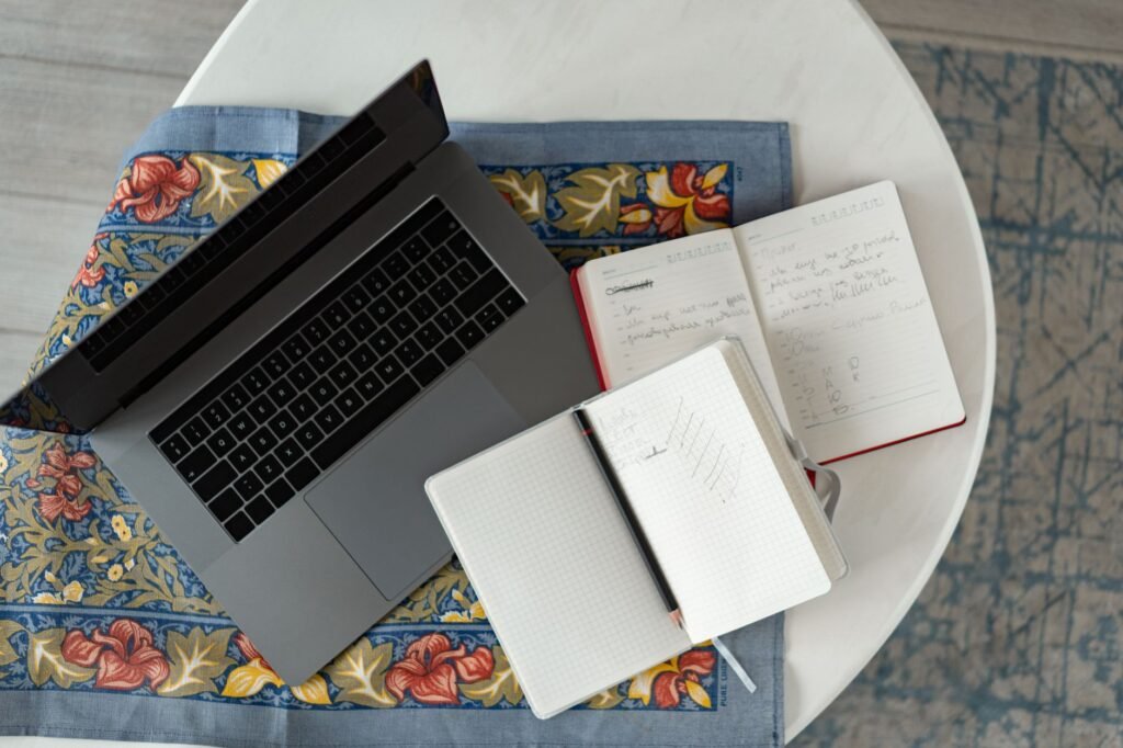 Notebook and phone used for planning a discreet trip
