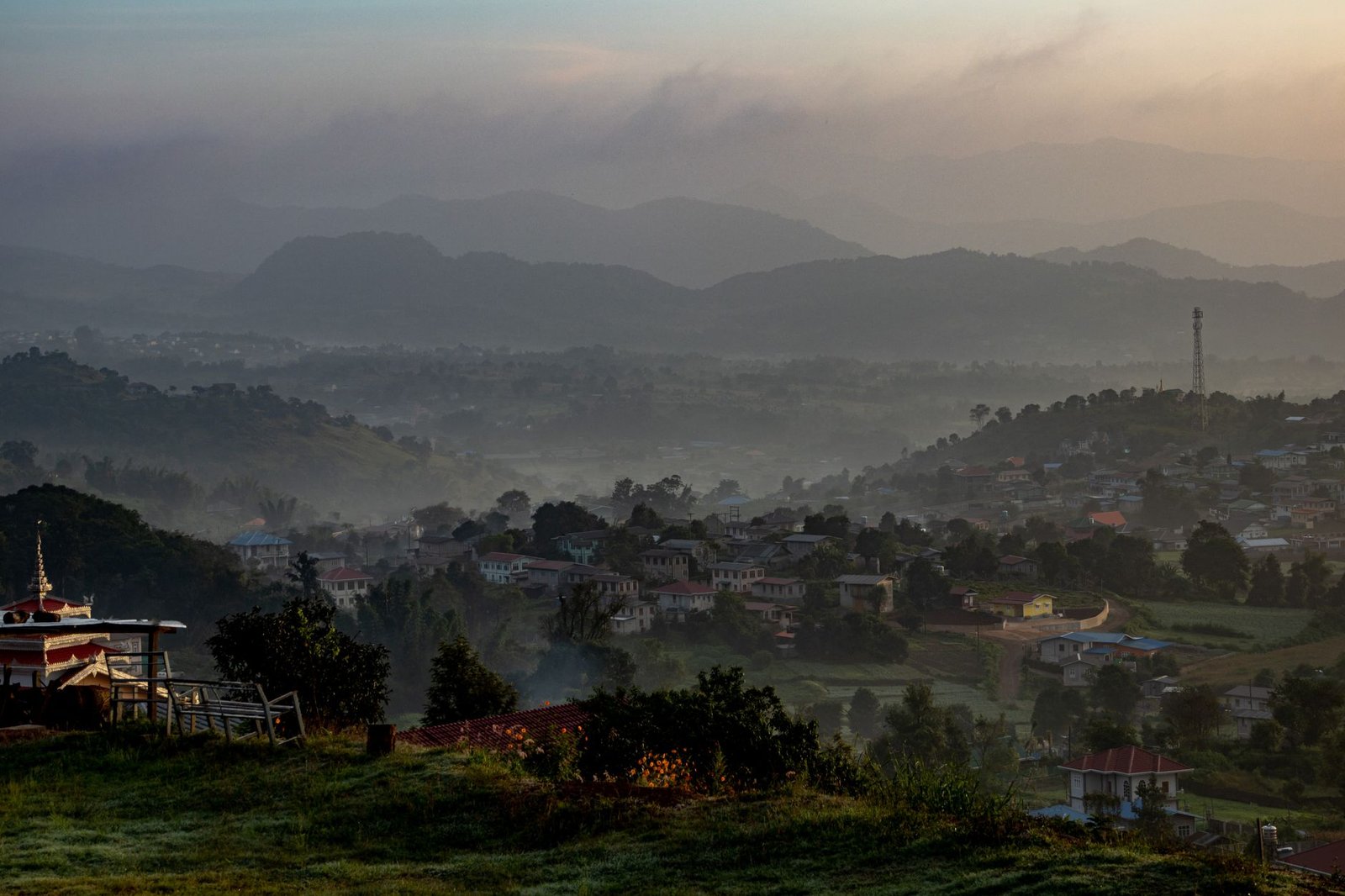 Quiet street in a Plateau State town at dusk
