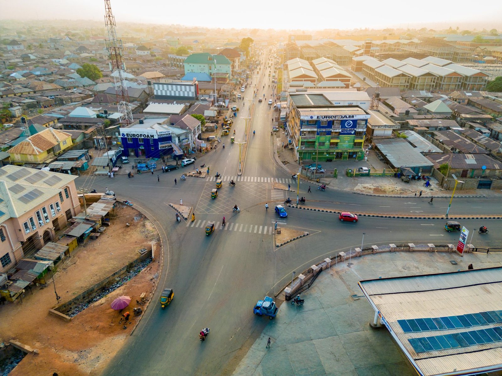 Quiet residential street in a Nigerian town at golden hour