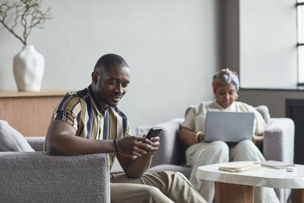 Visitor reviewing companion listings on a smartphone in a calm hotel lobby